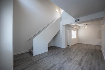 Navajo or pearl-colored hard flooring throughout